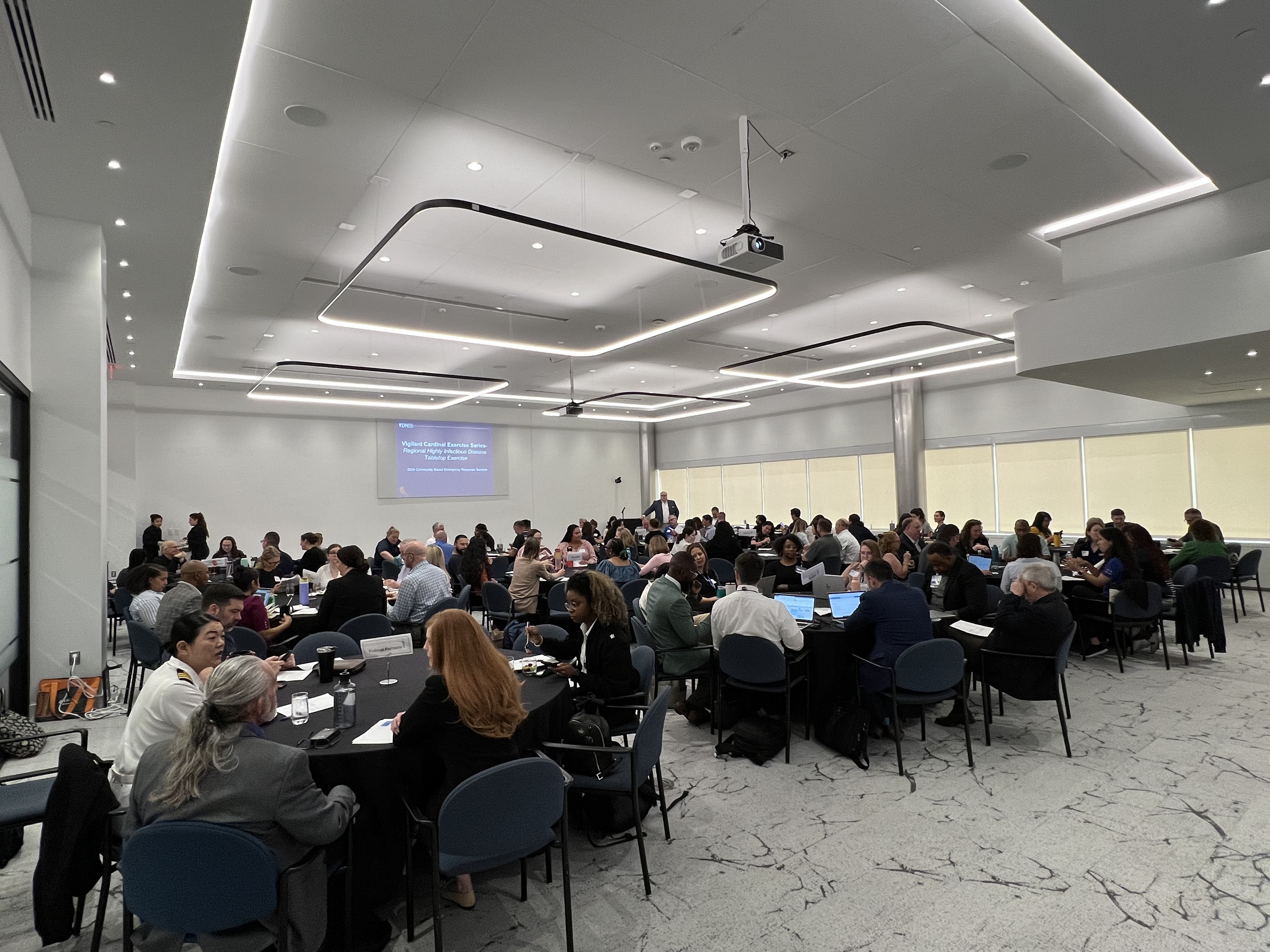 Exercise participants engaged in discussion during the 2024 HID TTX.
